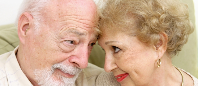 elderly couple staring into each other's eyes lovingly
