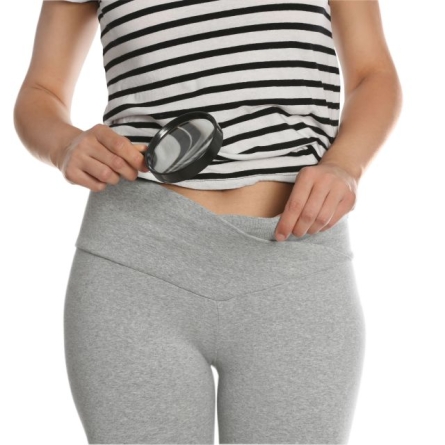 woman looking at private area with magnifying glass