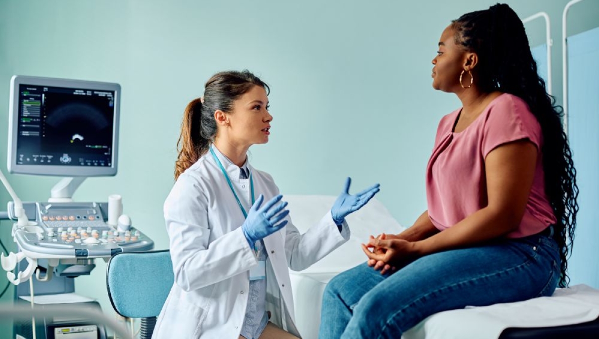 woman speaking with doctor
