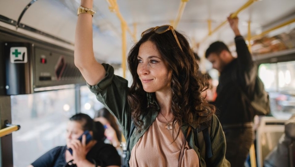 Woman standing on the bus