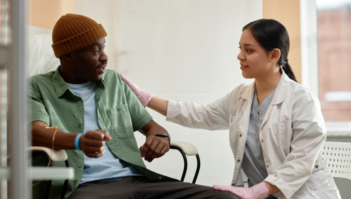 Ma speaking with doctor at chemotherapy appointment