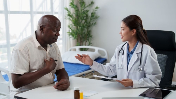 doctor speaking with older male